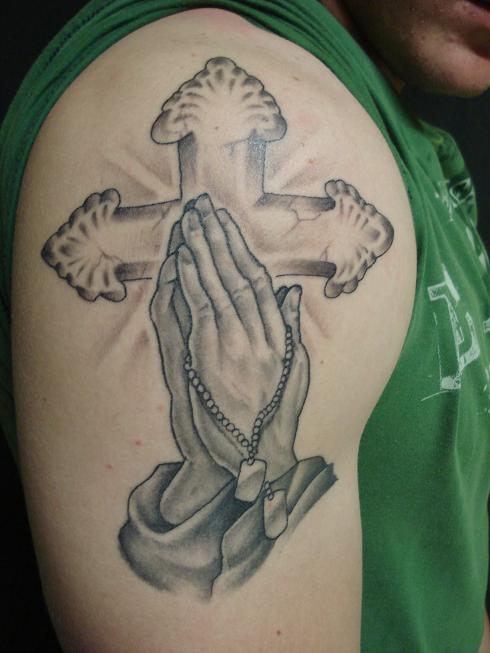 Cross with Praying Hands tattoo on shoulder