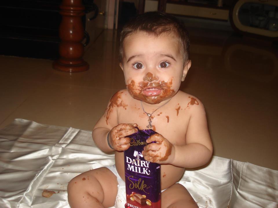 cute babies eating chocolates