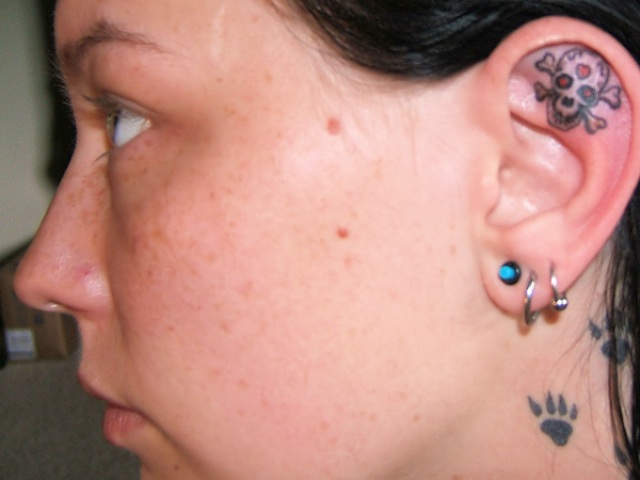 Danger Skull Tattoo On Girl Inside The Ear