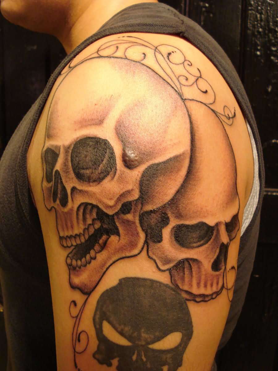 Dual Overhead Skulls Tattoo on Shoulder by Fabian Cobos