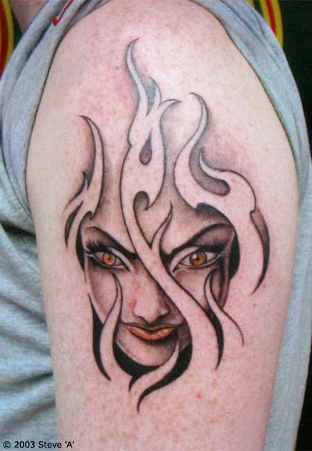 Girl Head In Flame Tattoo On Shoulder