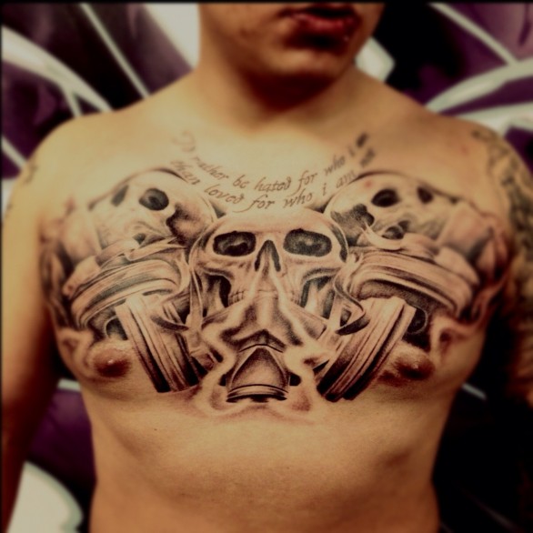 Grey Cross And Skull Graffiti Tattoo On Man Chest