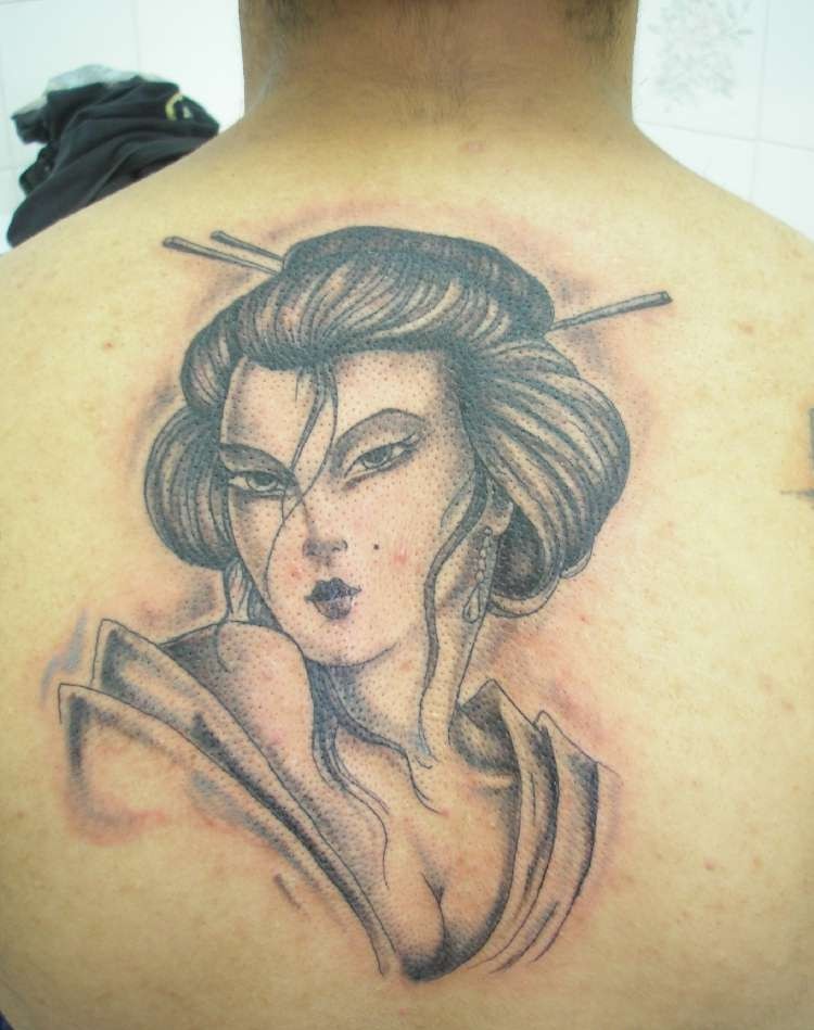 Grey Geisha Face Tattoo On Man Upper Back