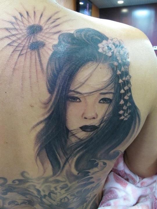 Grey Geisha Face Tattoo On Right Back Shoulder