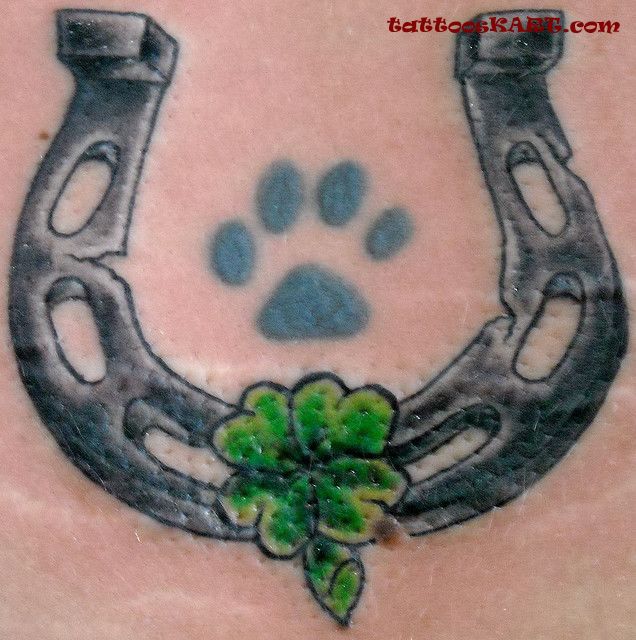 Grey Horseshoe With Clover Leaves Tattoo Design