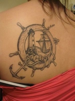 Grey Ink Nautical Ship Wheel Tattoo On Left Back Shoulder