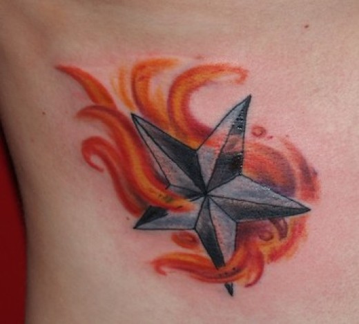 Grey Nautical Star In Red Fire Tattoo Design