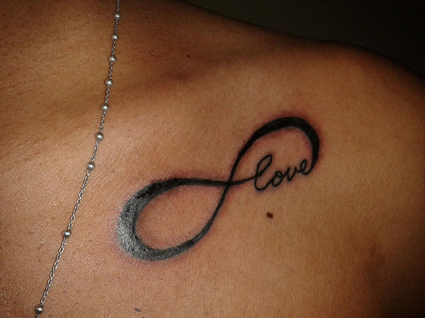 Infinity Love Tattoo On Left Collarbone