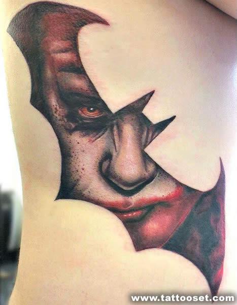 Joker Face In Bat Tattoo On Side Rib
