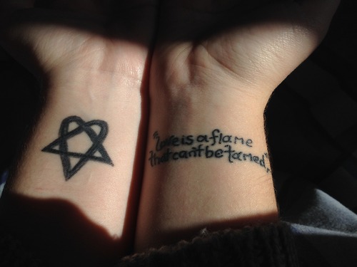 Lettering And Heartagram Tattoos On Wrists