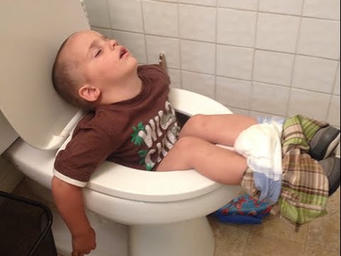 Little Kid Funny Sleeping On Toilet