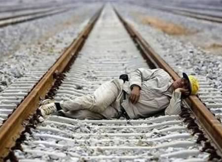 Man Funny Sleeping On The Railway Track