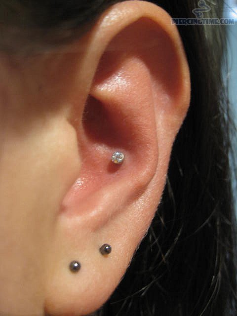 Nice Double Lobes And Conch Piercing For Young Girls