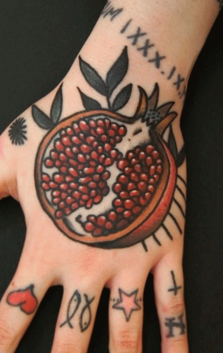 Red Half Pomegranate Fruit Tattoo On Hand