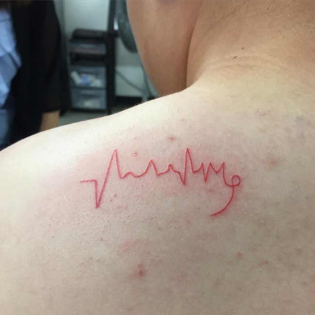 Red Heartbeat Tattoo On Left Back Shoulder
