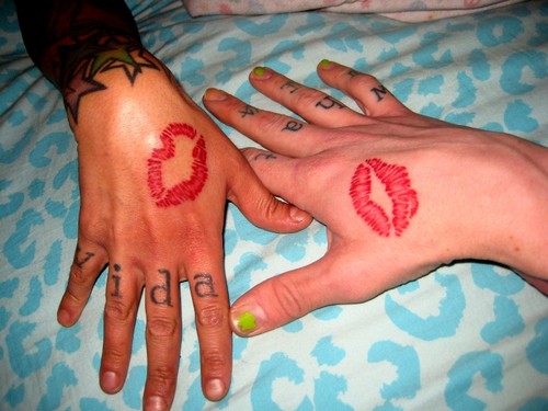 Red Lip Print Tattoo On Couple Hand By Darrien
