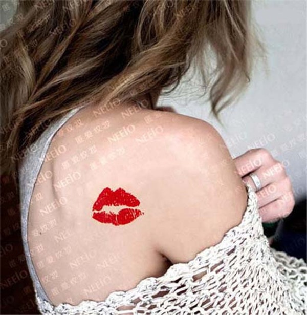 Red Lip Print Tattoo On Girl Right Back Shoulder