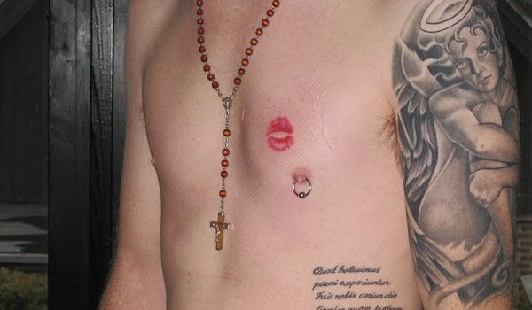 Red Lip Print Tattoo On Man Left Chest
