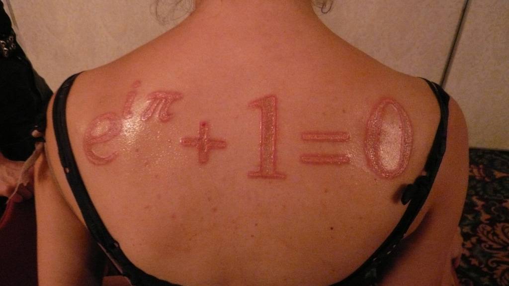 Red Math Formula Tattoo On Girl Upper Back