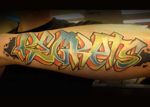 Regrets Graffiti Tattoo On Left Arm