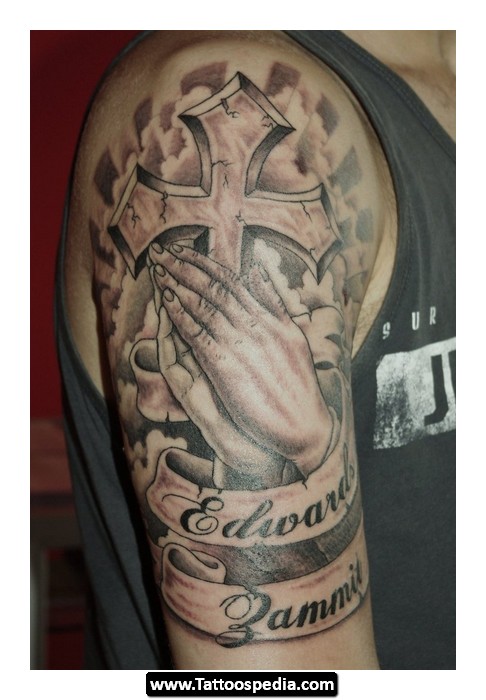 Religious Cross With Hand And Banner Tattoo On Shoulder