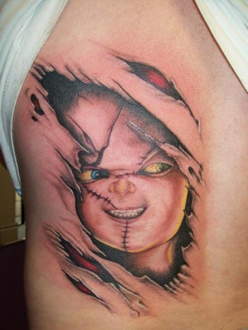 Ripped Skin Chucky Face Tattoo On Side Rib