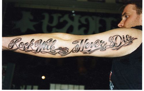Rock Will Never Die Wording Tattoo On Left Sleeve