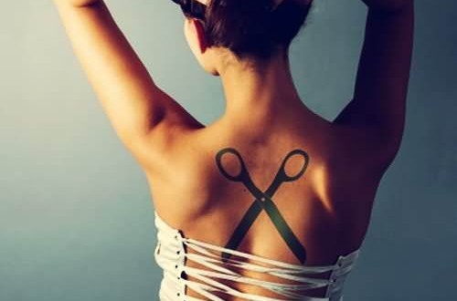 Silhouette Scissor Tattoo On Girl Upper Back