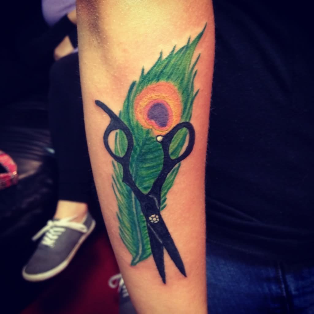 Silhouette Scissor With Colorful Peacock Feather Tattoo On Forearm