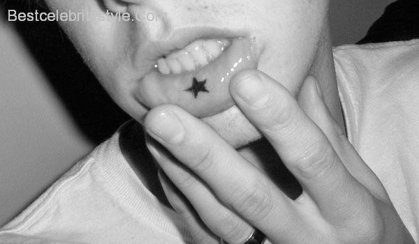 Silhouette Star Tattoo On Inner Lip