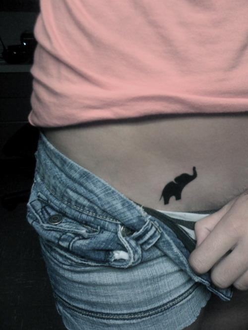 Silhouette Tiny Elephant Tattoo On Girl Hip