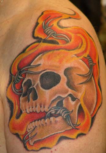 Skull In Fire Tattoo On Shoulder