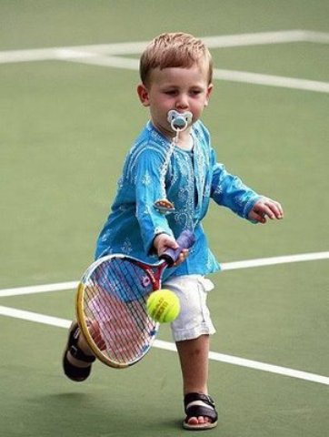 Small Baby Playing Funny Tennis