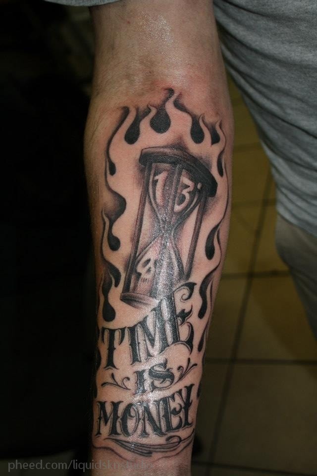 Time Is Money With Hourglass In Flame Tattoo On Forearm