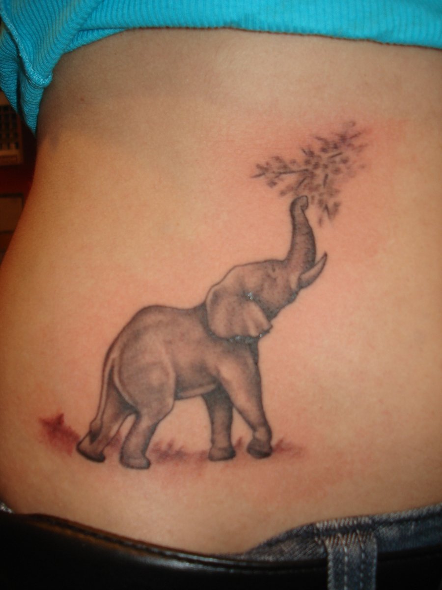 Tiny cute elephant tattoo on hip by Fabian Cobos