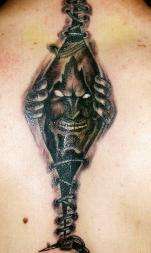 Torn Skin Gothic Tattoo On Back