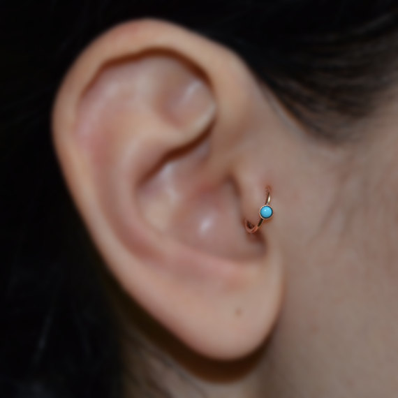 Tragus Piercing With Blue Hoop Gold Ring