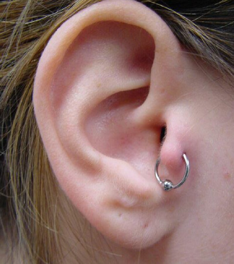 Tragus Piercing With Silver Hoop Ring