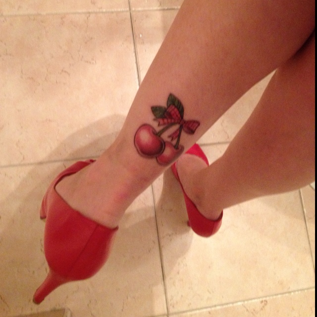 Two Red Cherry Tattoo On Girl Leg