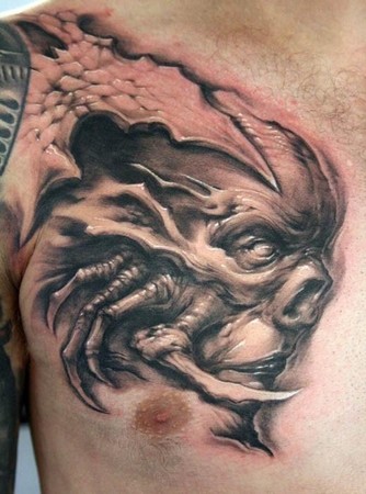 Unique Monster Face Tattoo On Man Right Chest