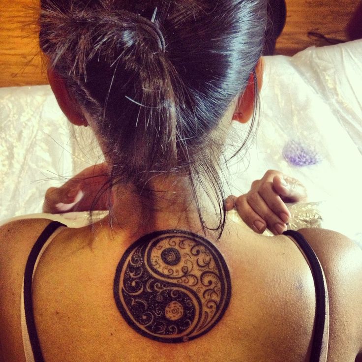 Unique Yin Yang Tattoo On Girl Upper Back