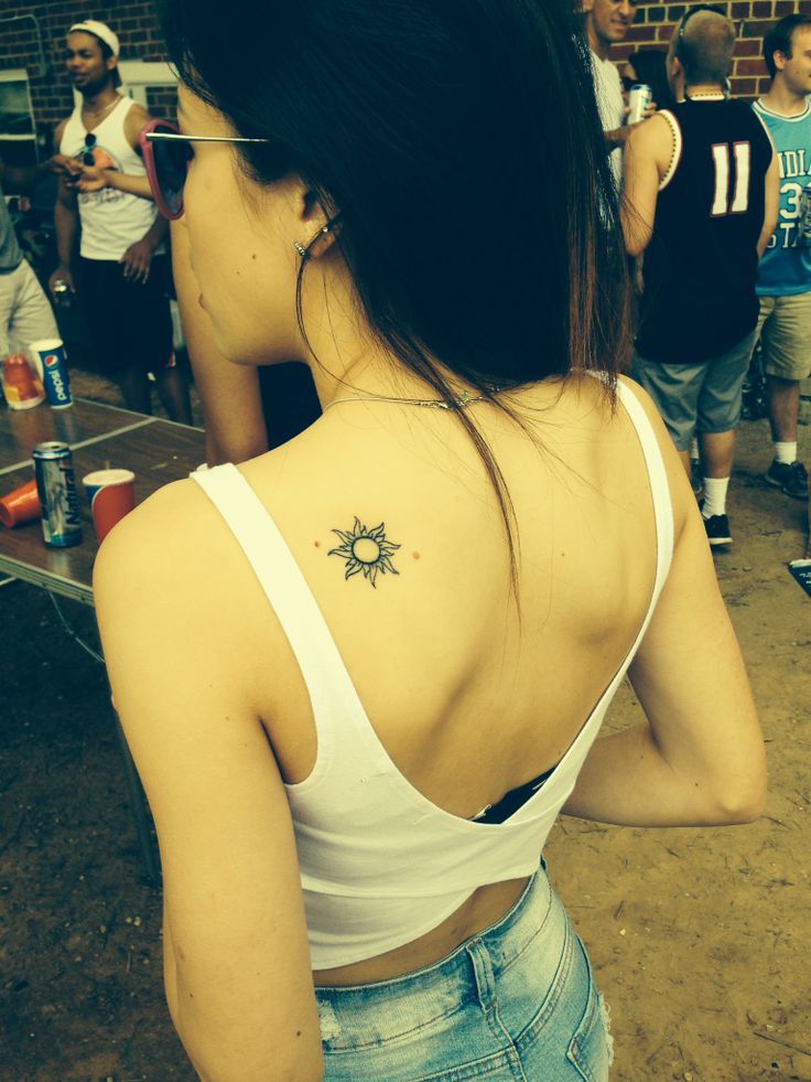 Amazing Black Sun Tattoo On Girl Left Back Shoulder