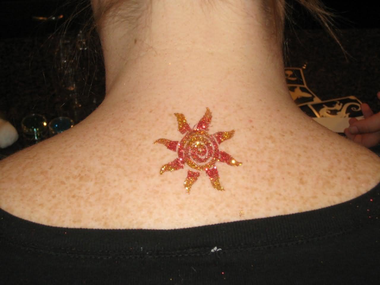 Amazing Glitter Sun Tattoo On Upper Back