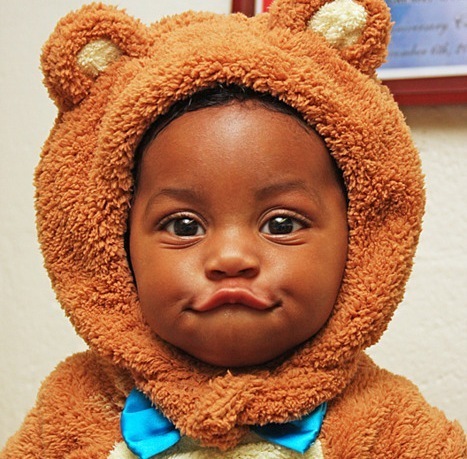 Baby In Animal Dress Making Funny Face