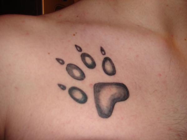Black And Grey Wolf Paw Tattoo On Front Shoulder By Anthony