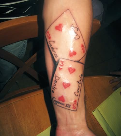 Black And Red Two Poker Cards Tattoo On Forearm