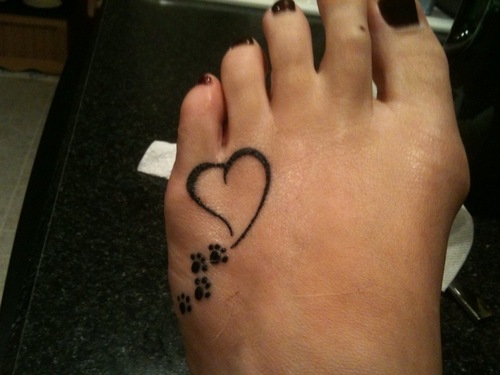 Black Four Tiny Paw With Heart Tattoo On Girl Foot