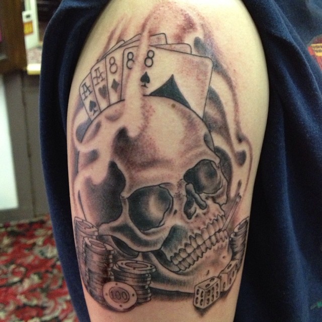 Black Poker Cards And Chips With Banner Tattoo On Shoulder