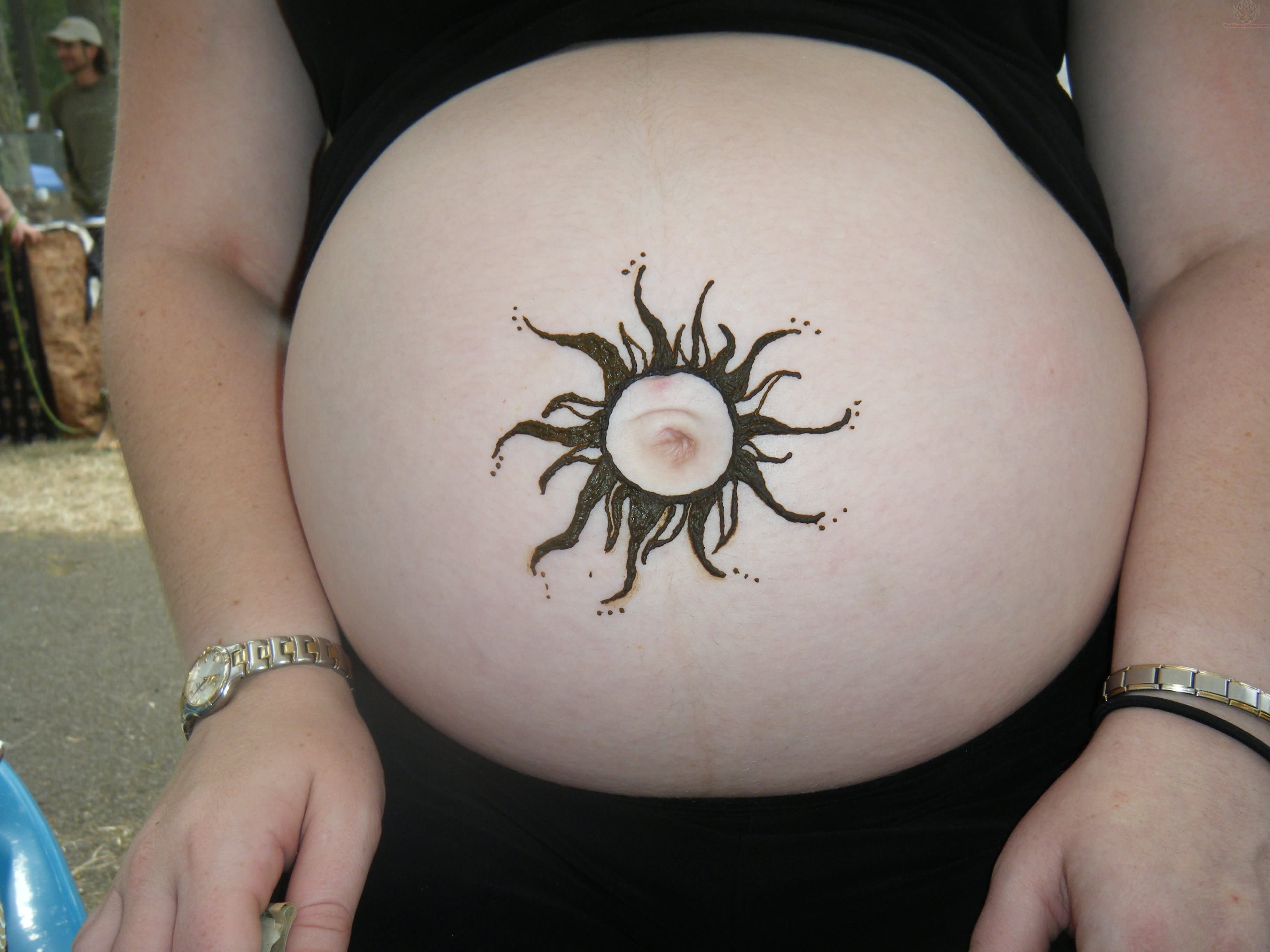 Black Sun Tattoo On Girl Belly Button