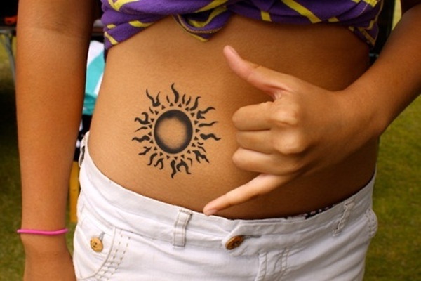 Black Sun Tattoo On Girl Stomach